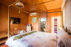 Ein Bett oder Betten in einem Zimmer der Unterkunft Pao Come Boutique House