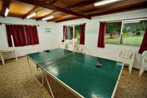 a ping pong table in a living room with a ping pongetitive at La Posta de la Laguna in La Paloma