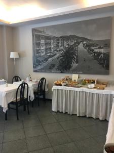 Um restaurante ou outro lugar para comer em Hotel Internazionale
