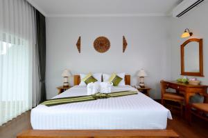 Postel nebo postele na pokoji v ubytování Princess River Kwai Hotel