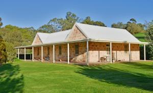 a large brick house with a large yard at Bungaree Station in Clare