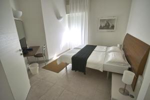 Voodi või voodid majutusasutuse Hotel L'Approdo toas