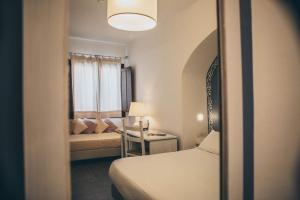 Rúm í herbergi á Boutique Hotel Sant'Andrea & Relais