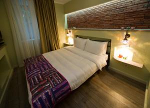 Postel nebo postele na pokoji v ubytování No12 Boutique Hotel