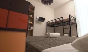 A bed or beds in a room at Domus Amica