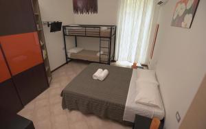 A bed or beds in a room at Domus Amica