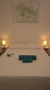 Ένα ή περισσότερα κρεβάτια σε δωμάτιο στο Domus Amica