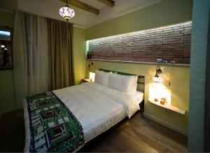 Postel nebo postele na pokoji v ubytování No12 Boutique Hotel