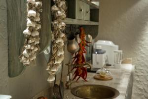 a kitchen with a sink with shells on the wall at No12 Boutique Hotel in Tbilisi City