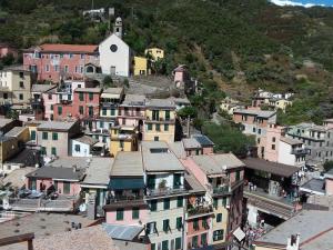 a group of buildings on a hill with a town at Affittacamere Elisabetta in Vernazza