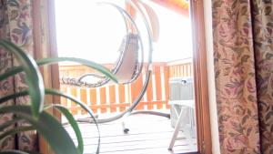 a metal railing on a porch next to a window at Auszeit-Wohnungen in Aidenbach +47 photos