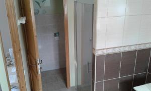 a shower with a glass door in a bathroom at Chambre d'hotes Le Hamel in Le Hamel +27 photos