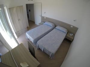 A bed or beds in a room at Appartamenti Torre