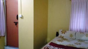 Postel nebo postele na pokoji v ubytování Akashadeepa Homestay