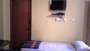 Postel nebo postele na pokoji v ubytování Akashadeepa Homestay