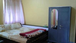 Postel nebo postele na pokoji v ubytování Akashadeepa Homestay
