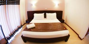 Postelja oz. postelje v sobi nastanitve Hotel Shanelo
