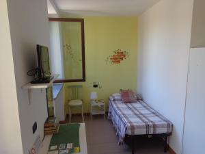 Postel nebo postele na pokoji v ubytování La Corte B&B