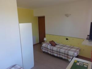 Postel nebo postele na pokoji v ubytování La Corte B&B