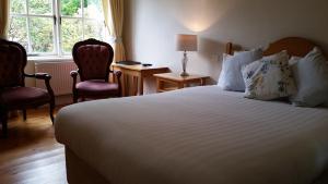 Voodi või voodid majutusasutuse The Waterfront Hotel toas
