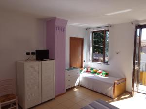 Postel nebo postele na pokoji v ubytování La Corte B&B