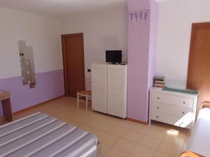 TV a/nebo společenská místnost v ubytování La Corte B&B