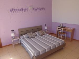 Postel nebo postele na pokoji v ubytování La Corte B&B