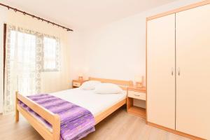 Postel nebo postele na pokoji v ubytování Apartments Zoricic
