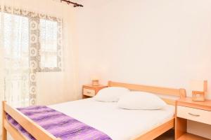 Postel nebo postele na pokoji v ubytování Apartments Zoricic