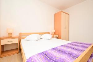 Postel nebo postele na pokoji v ubytování Apartments Zoricic