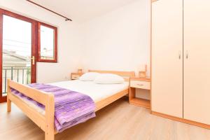 Postel nebo postele na pokoji v ubytování Apartments Zoricic
