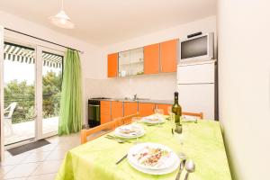Kuchyň nebo kuchyňský kout v ubytování Apartments Zoricic + 32 fotografií