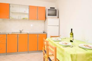 Kuchyň nebo kuchyňský kout v ubytování Apartments Zoricic