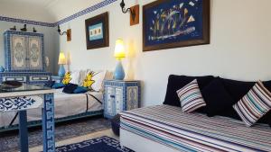 Ένα ή περισσότερα κρεβάτια σε δωμάτιο στο Riad Jenaï L'Authentique