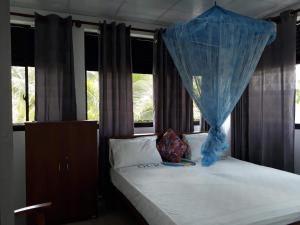 Katil atau katil-katil dalam bilik di Relax Inn Hikkaduwa