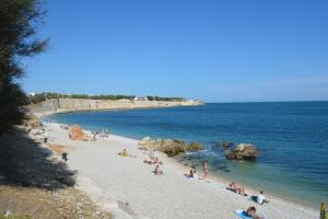 a group of people on a beach in the water at Nido dei gabbiani in Bisceglie