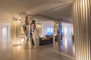 a room with two large columns in a building at Hotel Oasi Di Kufra in Sabaudia