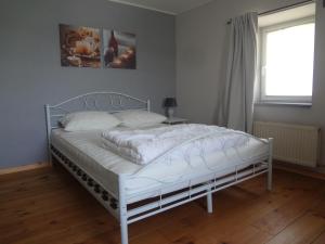 Un pat sau paturi într-o cameră la An Hütten
