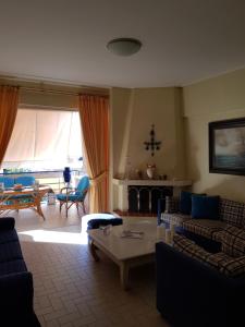 Posezení v ubytování Rafina K-Apartment
