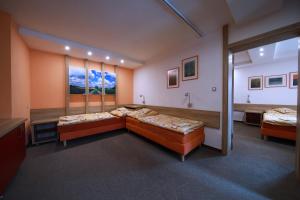 Posteľ alebo postele v izbe v ubytovaní Wellness Penzion Pod Rozhlednou
