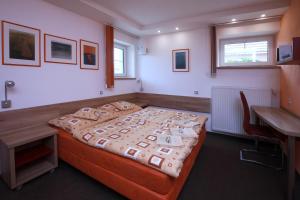 Postel nebo postele na pokoji v ubytování Wellness Penzion Pod Rozhlednou