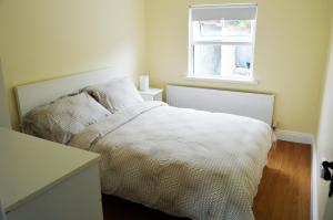 Llit o llits en una habitació de Ash Tree Cottage