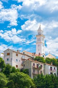 a building with a clock tower on top of it at Vito in Novi Vinodolski