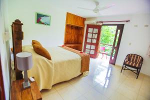 Postel nebo postele na pokoji v ubytování Hotel Rancho Don Cesar