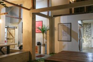 a room with a table and a potted plant at Trava House in Yogyakarta