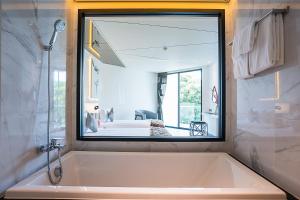 Ein Badezimmer in der Unterkunft Mera Mare Pattaya