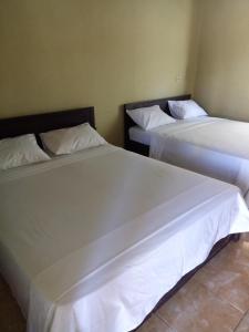 Postel nebo postele na pokoji v ubytování Syifa Homestay