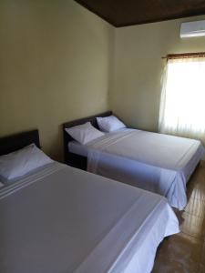 Postel nebo postele na pokoji v ubytování Syifa Homestay