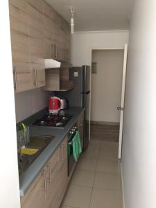 Kuchyň nebo kuchyňský kout v ubytování Departamento Concón
