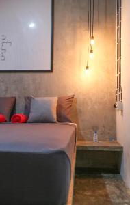 a bedroom with a bed and a table and a whiteboard at Trava House in Yogyakarta